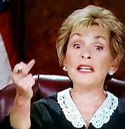 Judge Judy raising her middle finger